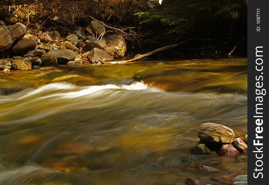 This image of the stream was taken in western MT at a slow shutter speed. This image of the stream was taken in western MT at a slow shutter speed.