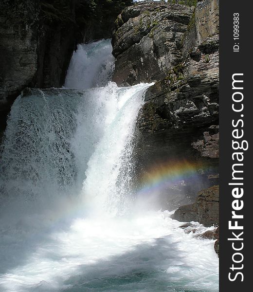 This image of St Mary Falls with the rainbow was taken while hiking in Glacier National Park.