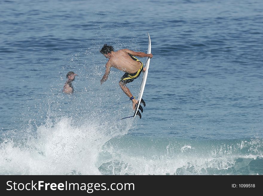 Surfer catching air. Surfer catching air
