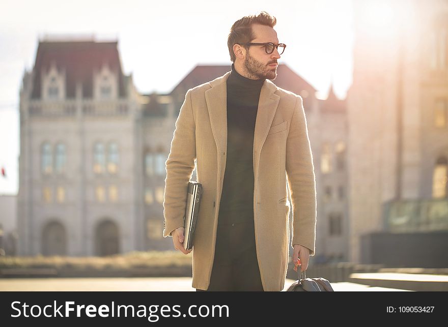 Man Wearing Brown Coat