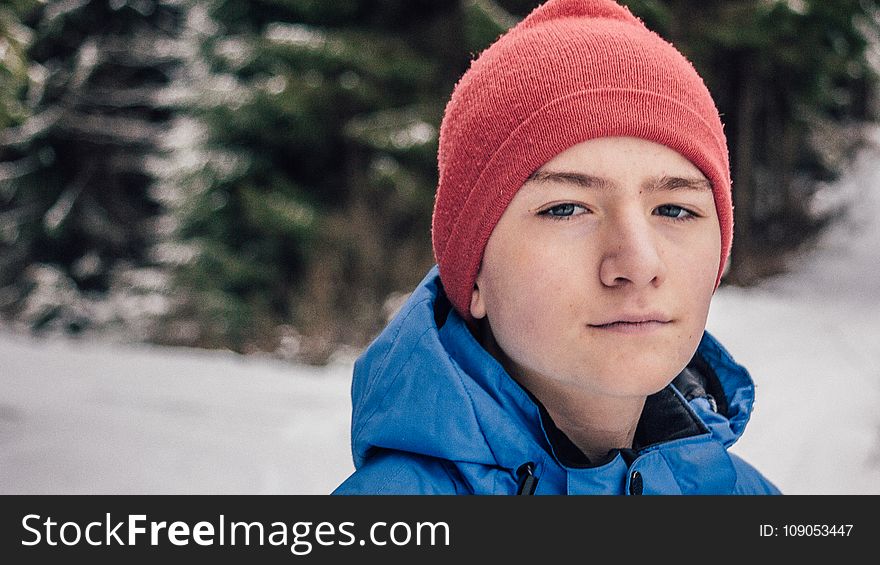 Man in Blue Hoodie Jacket With Red Beanie