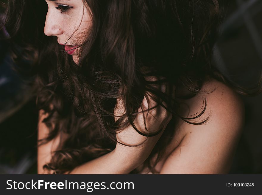 Close-Up Photography of a Woman Holding Her Hair