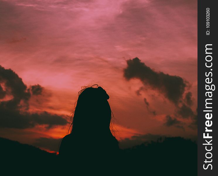 Silhouette of a Woman During Dawn