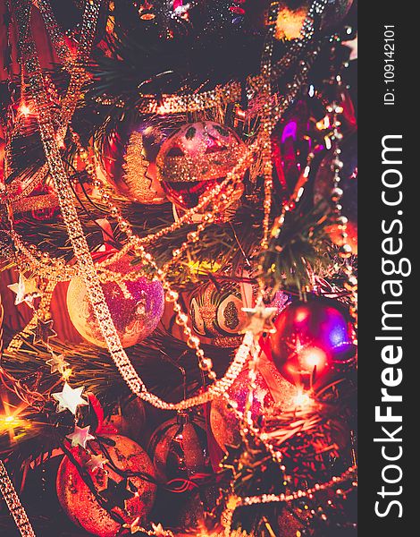 Decorated Christmas tree and colorful garland lights, filtered. Decorated Christmas tree and colorful garland lights, filtered.