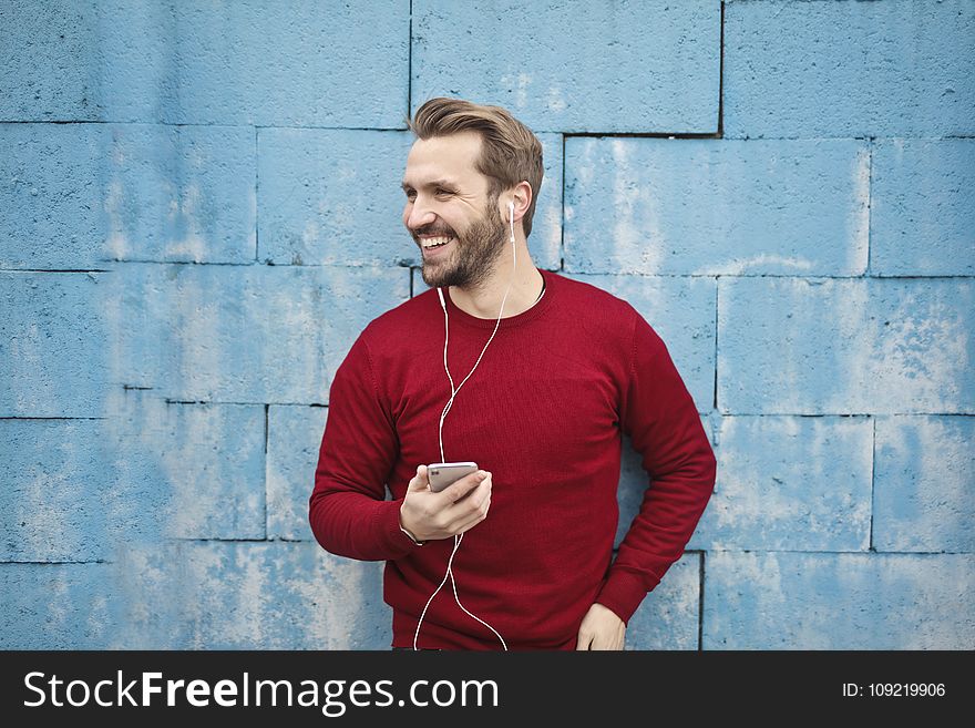 Photo Of A Man Listening Music On His Phone