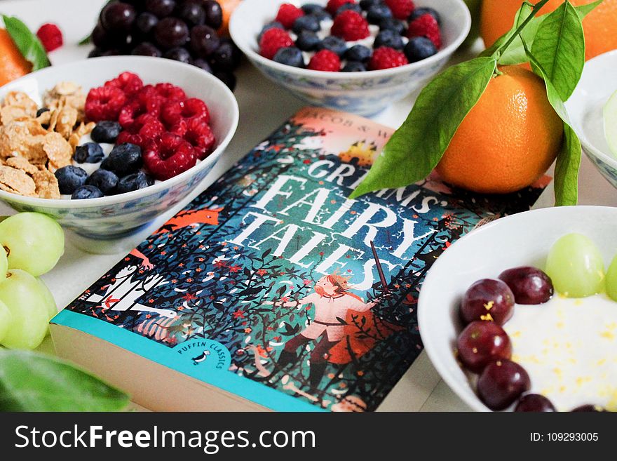 Grimms Fairy Tales Book Surrounded by Fruits