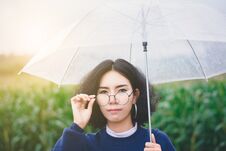 Portrait Of Beautiful Asian Woman Enjoy Natural Outdoor At Corn Stock Photo