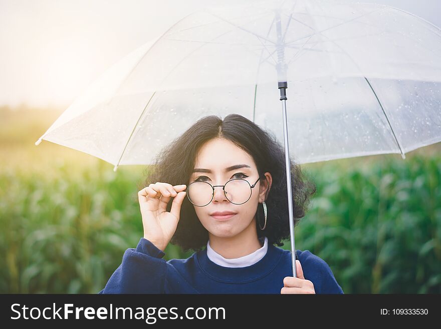 Portrait of beautiful Asian woman enjoy natural outdoor at corn