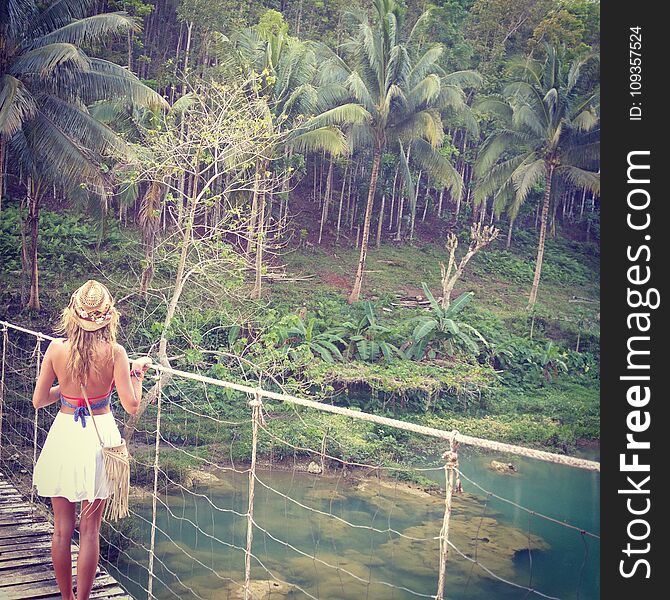 The girl is standing on a Caribbean island. Carenero, Bocas del Toro, Panama