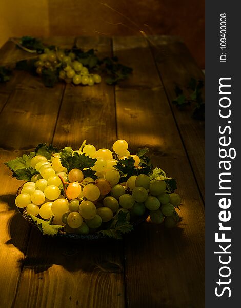 White grapes on wooden plane