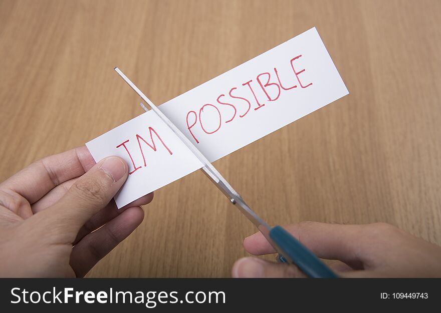 Business Hand Holding Scissors For Cutting Word Impossible