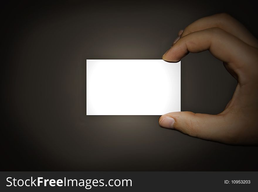 A man holding a business card