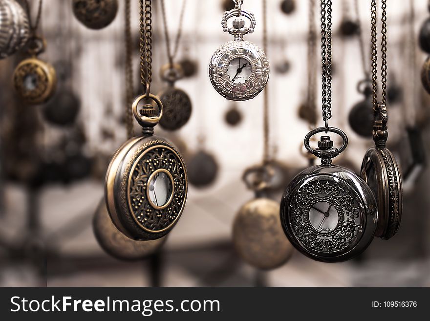 Assorted Silver-colored Pocket Watch Lot Selective Focus Photo