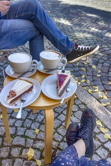 Street Cafe In Weimar, Germany. Two Cups Of Coffee Latte And A Pieces Of Cake Stock Photo