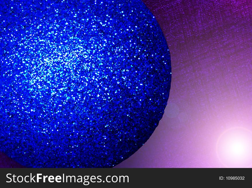 An extreme close-up of a blue christmas bauble. An extreme close-up of a blue christmas bauble