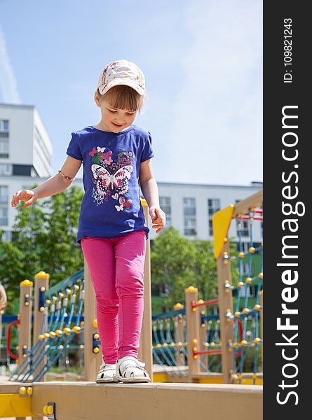 Pretty Little Girl On Playground