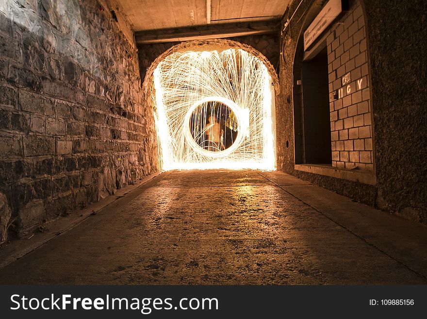 Timelapse Photo of Man in Hallway With Light