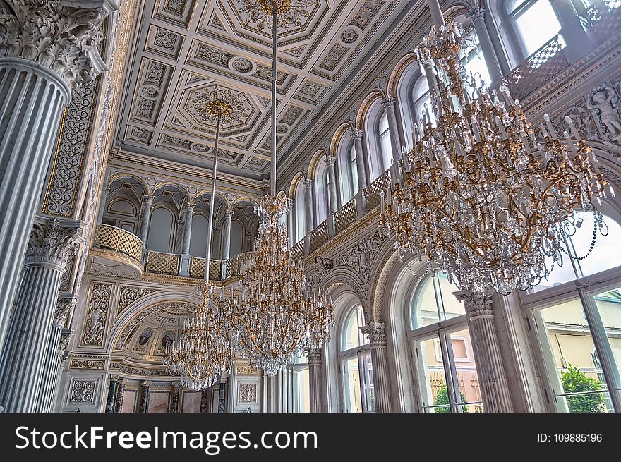 White Cathedral Hanging With Three Brown Uplight Chandelier