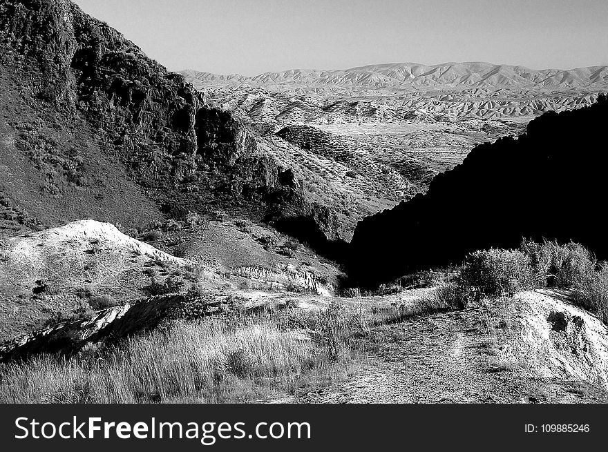 Grayscale Photo of Mountain Range
