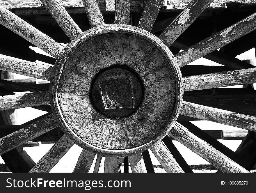 Grayscale Photography Of Carriage Wheel