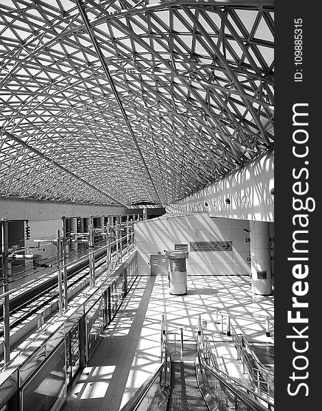 Grey Steel Frame Building Ceiling in Black and White Photograph during Daytime