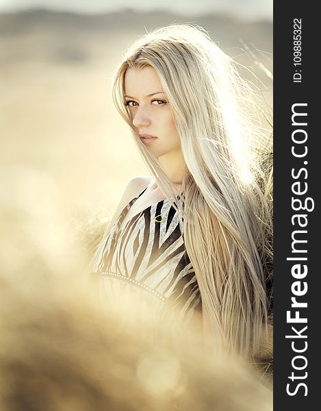 Blonde Haired Woman In Open Field Photoshoot During Daytime