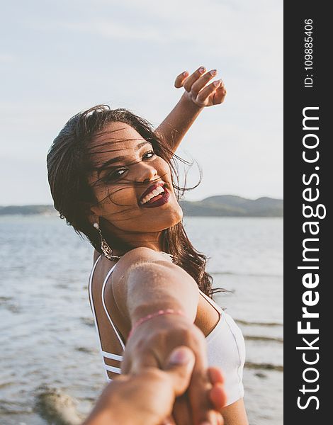 Woman Wearing White Bralet Near Seashore During Daytime