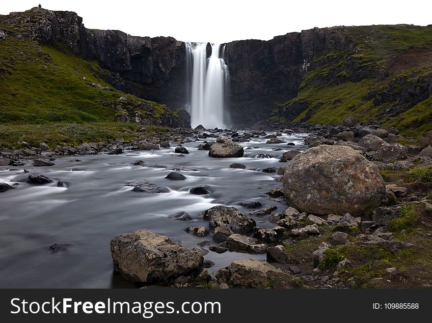 Timelapse Photography Of Water Falls On Rock Cliff During Daytime