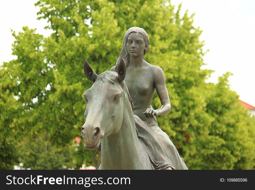 Woman Riding Horse Statue
