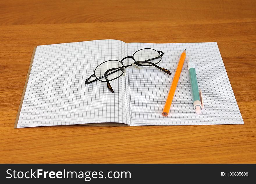Black Framed Eyeglass on Graphing Paper
