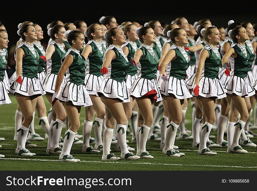 Group of Cheerleader on Green Field
