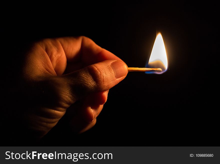 Person Holding Match Stick