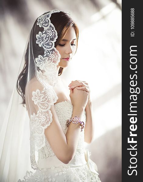 Woman In White Bridal Gown Meditating