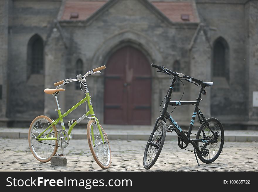 Green Bike Beside Black Bike