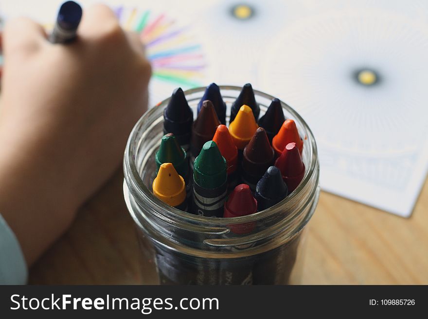 Multicolored Crayons Inside Clear Plastic Round Case