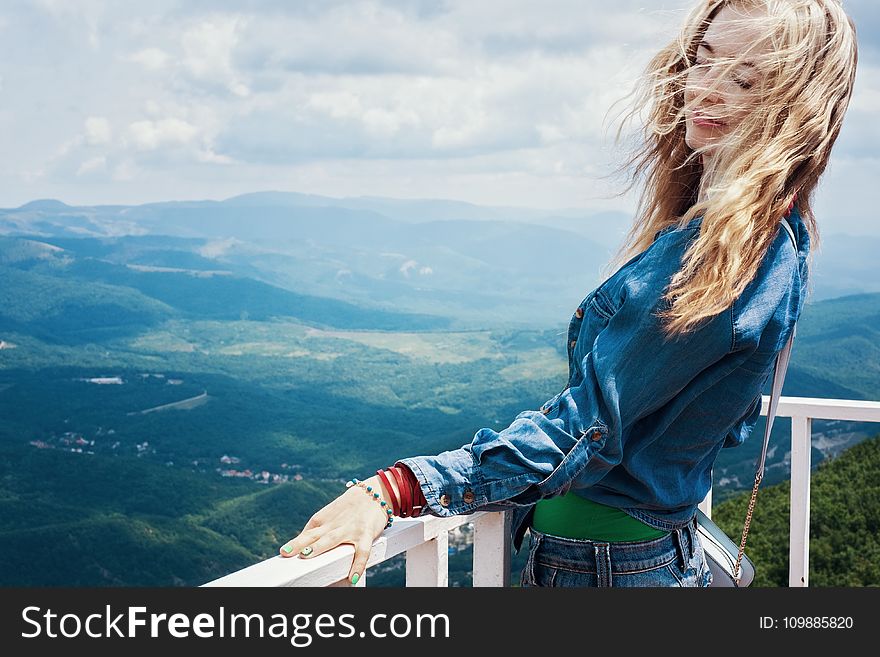 Woman In Blue Shirt Sightseeing