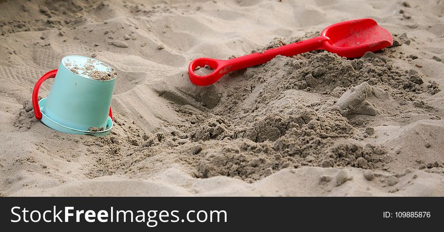 Teal Sand Pail Near Sand Shovel Toy