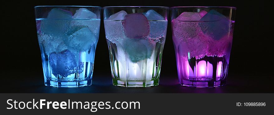 Blue White and Purple Beverage With Ice on Clear Drinking Glass