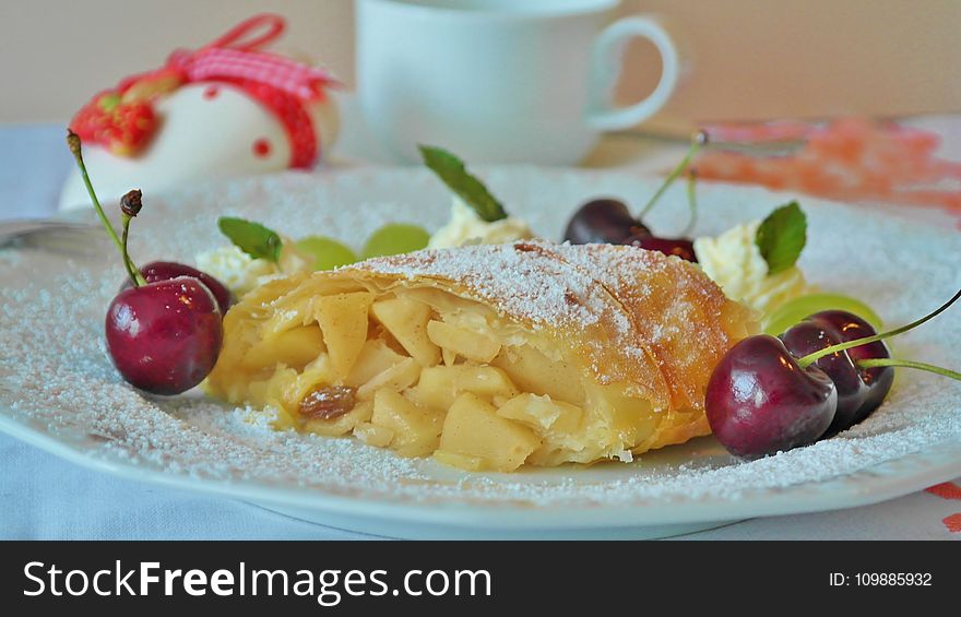 Yellow Pastry And Red Cherry In White Ceramic Dining Plate