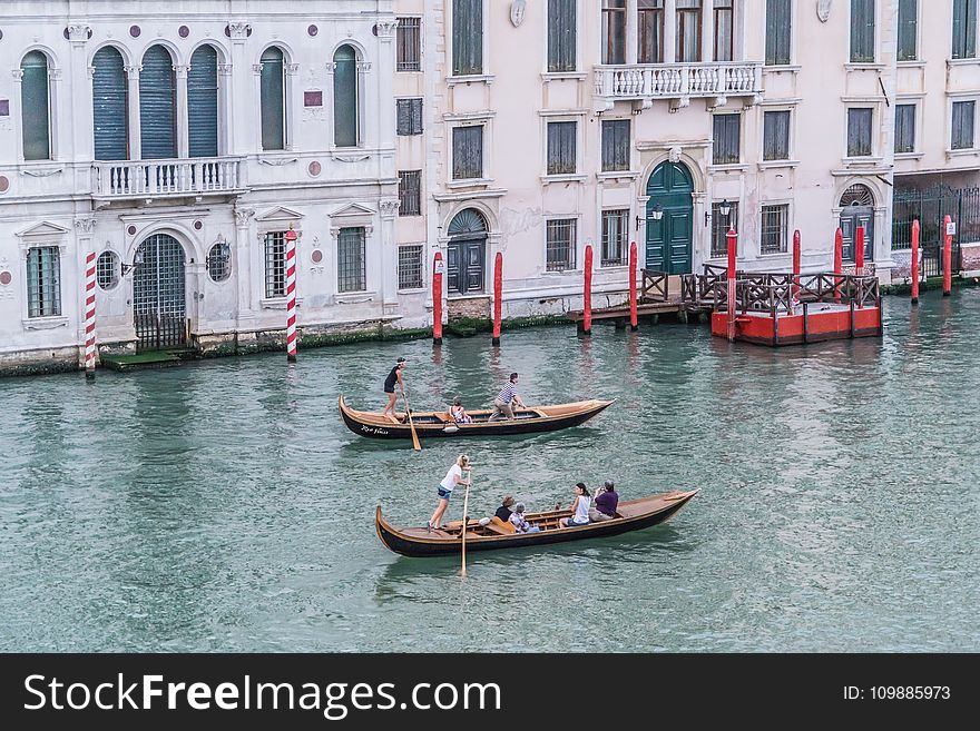 Green Canoe With People Inside