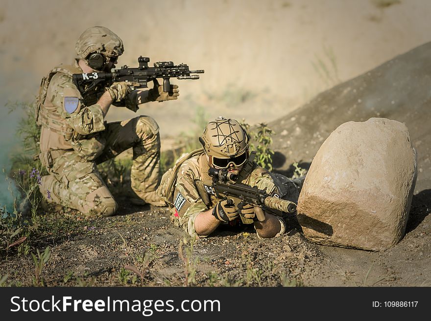 Military Sniping Near Rock