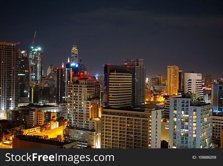 Concrete High Rise Building During Night Time