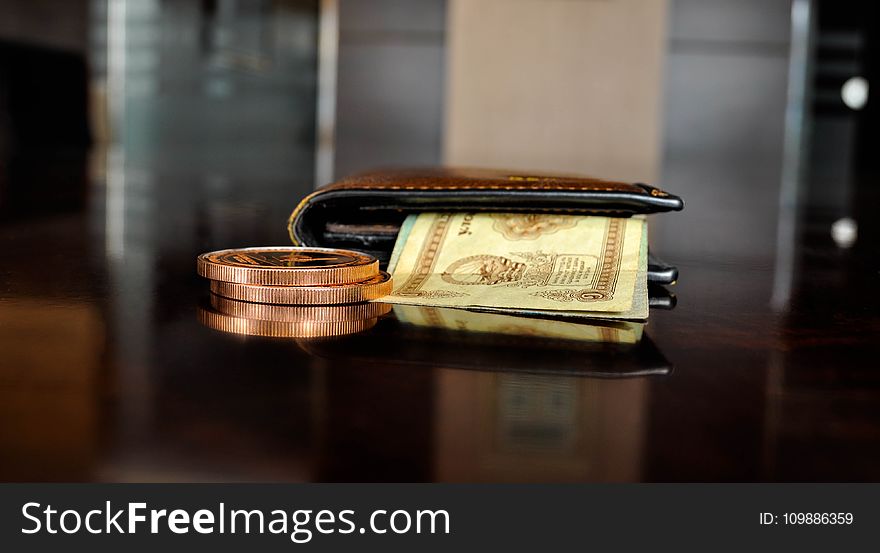 Brown Leather Bifold Wallet With Banknotes Sticking Out