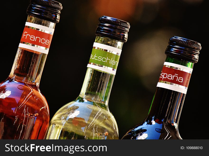 Shallow Focus Photofrapy of France Leutschien Espana Labeled Glass Bottles