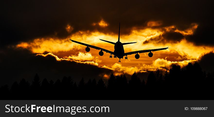 Airplane Silhouette on Air during Sunset
