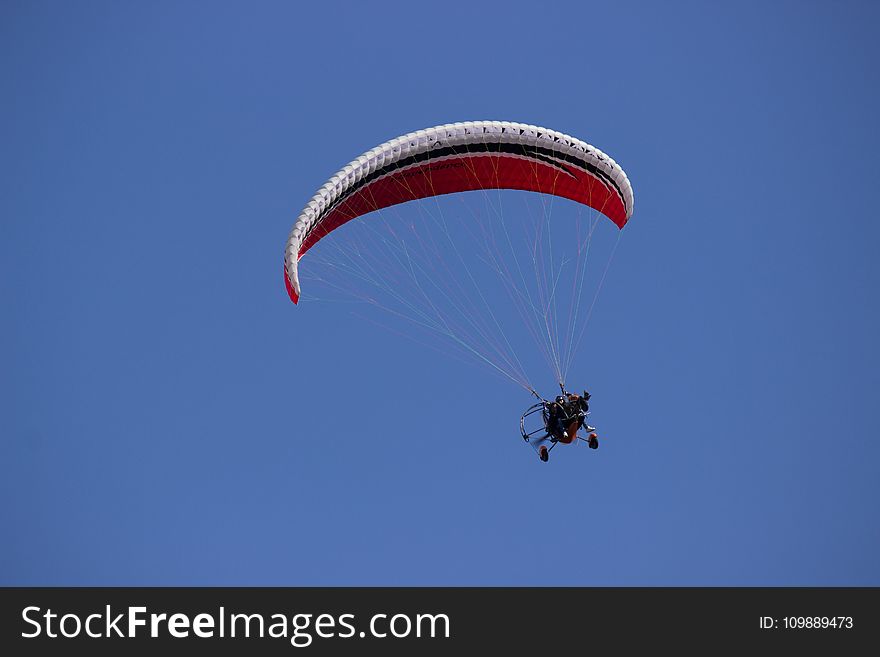 Person Paragliding during Daytime