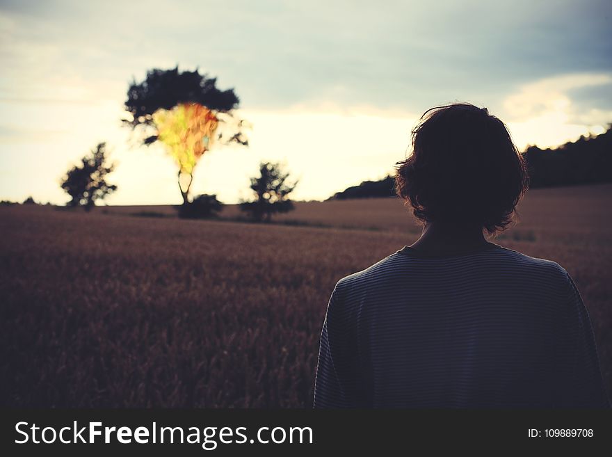 Woman Looking At Sunset