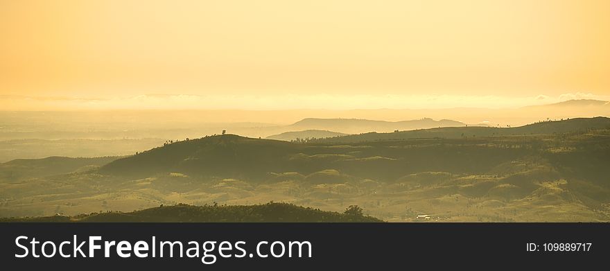 Scenic View of Mountains Against Dramatic Sky