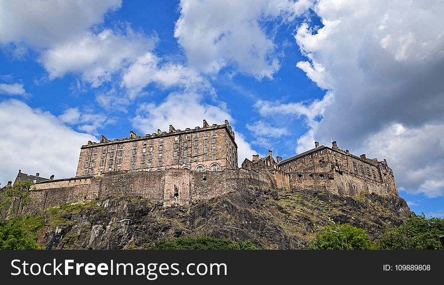 Low Angle View Of Fort Against Cloudy Sky