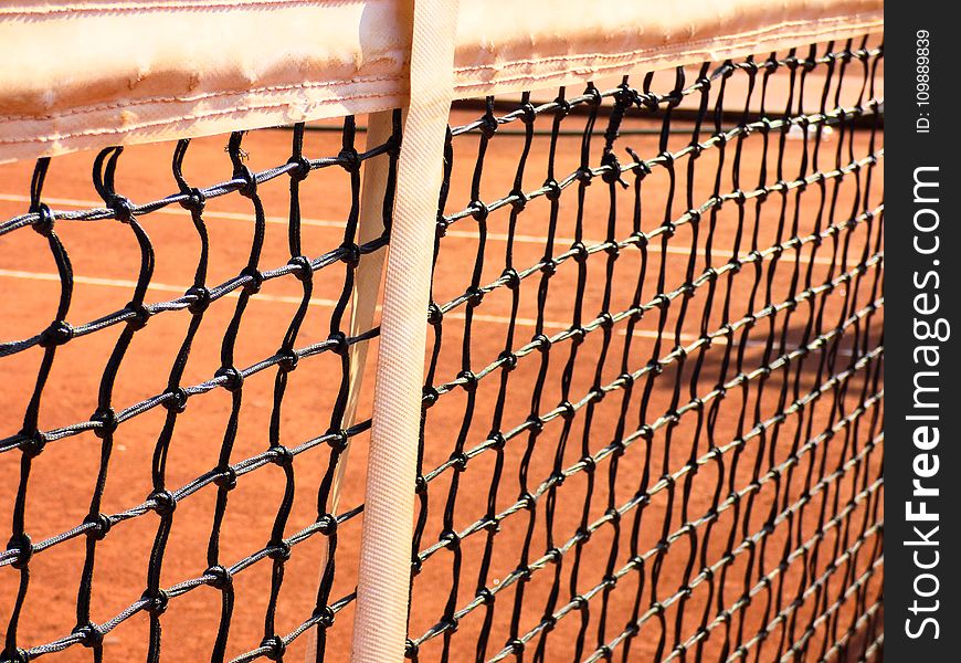 Close-up of Chainlink Fence Against Sky